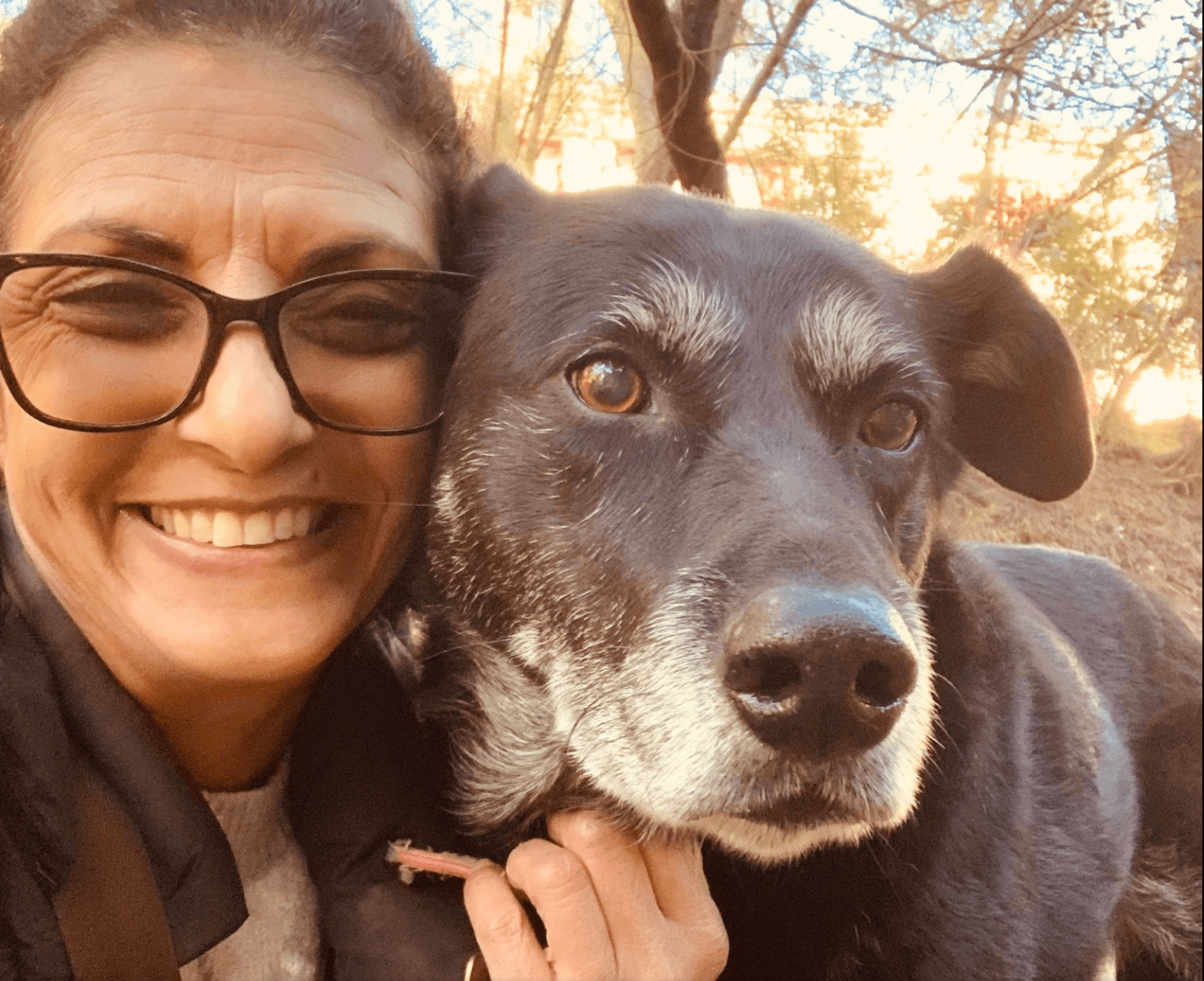 The owner of Doggli Pet Care with a beloved dog